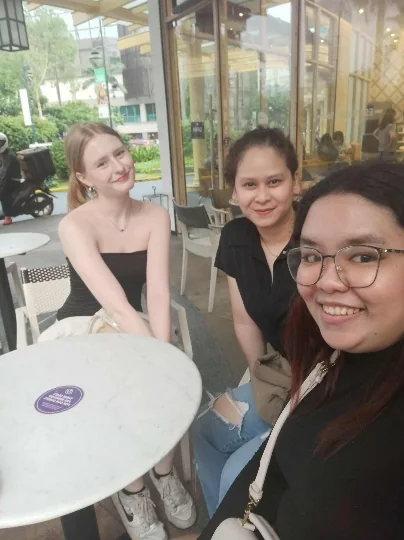 Lisa meeting colleagues from the Philippines team in person.
